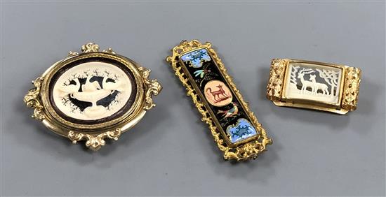 A Victorian pinchbeck Pliny Doves swivelling brooch and two other gilt metal brooches including enamel.